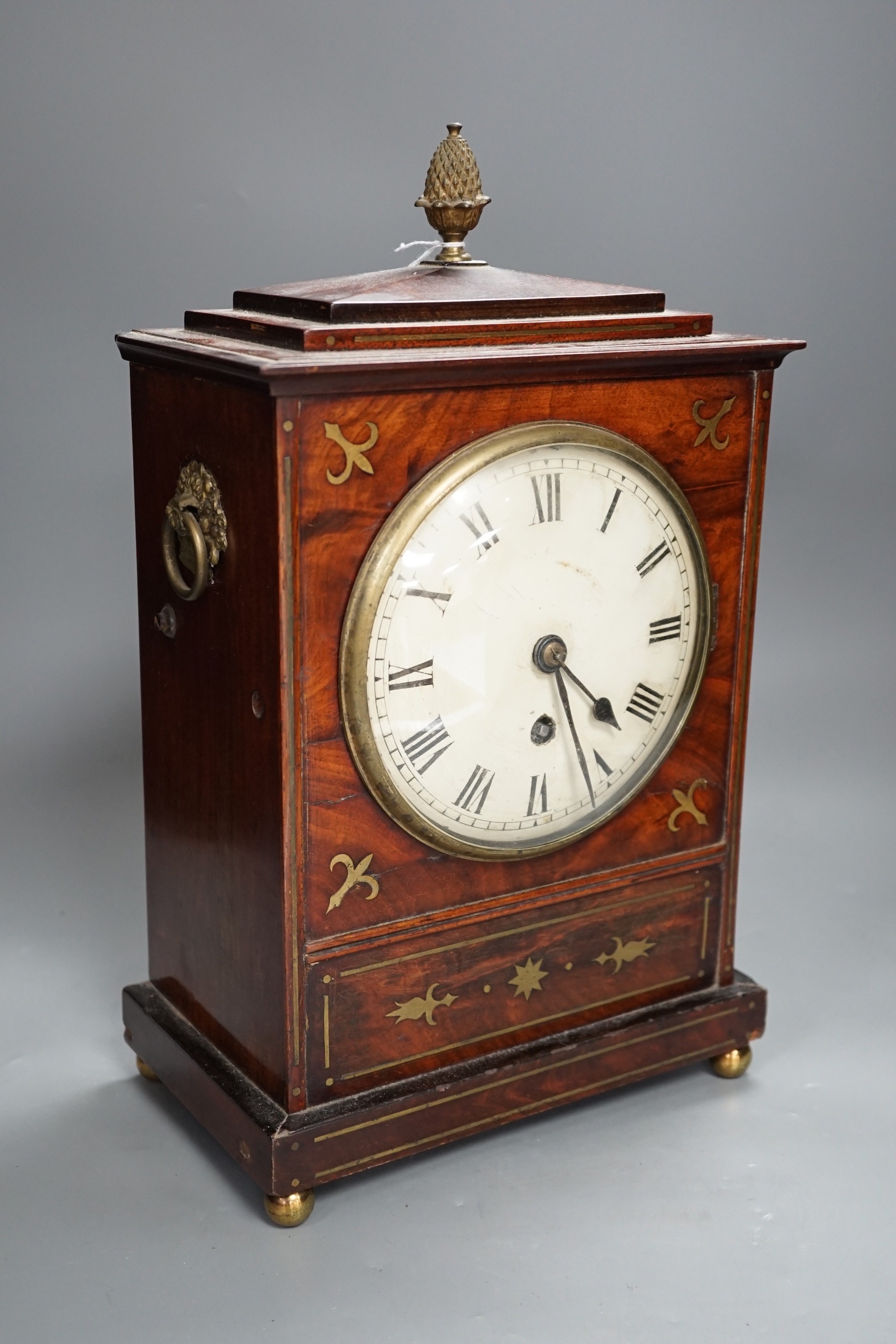 A Regency brass inset mahogany mantel timepiece, 39cm high